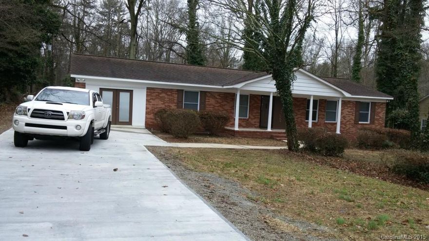 Beautiful ranch style country living home, open floor plan, nice front porch, large deck and huge back yard.  Moved in ready with neutral fresh paint, tile and hardwood flooring, new insulated windows, kitchen island, new stainless steel appliances, back splash, granite counter top and new concrete driveway. Convenience to Uptown Charlotte, North Lake Mall, Lake Norman, Concord Mills and Concord Speedway.  1 year Home Warranty with Old Republic.   Home in excellent/move in condition, must see.