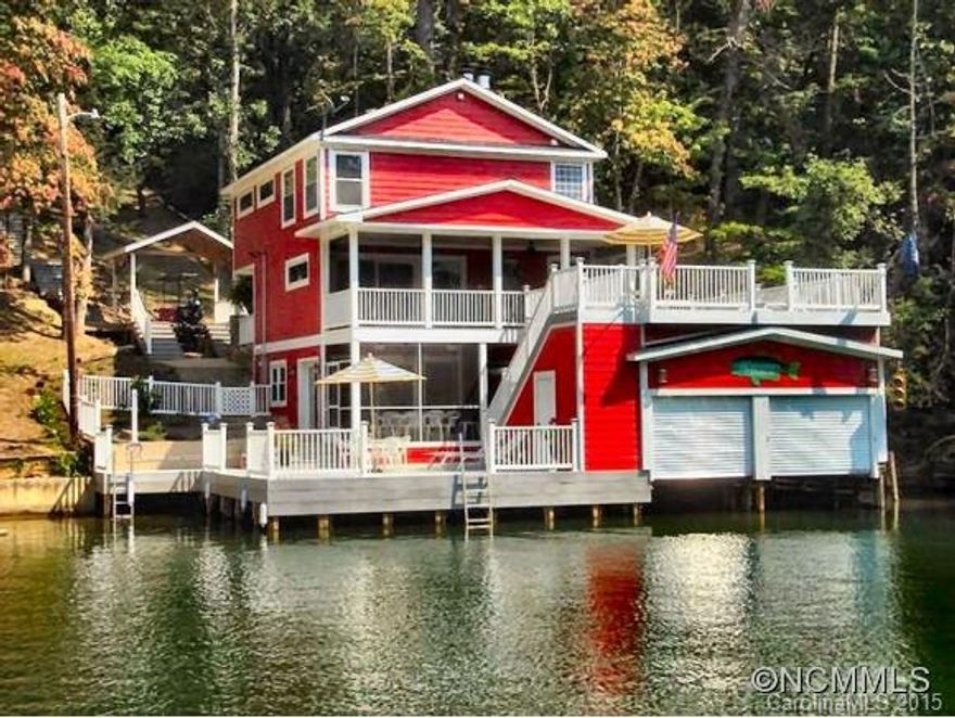 After an extensive renovation in 2008, this home on Lake Lure was transformed into a truly unique and enduring residence. New features include all new plumbing, wiring, a completely remodeled kitchen with granite counters, claw foot tubs and glass-enclosed showers, and hardwood floors throughout. A trolley from street level to the front door makes for easy access to the home while the Trex decks allow easy access to the lake and double boathouse.