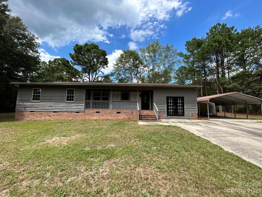 Looking for that hard to find home with excess acreage and room to spread out...look no further! This completely renovated home sits on over two and a half acres of privacy. The 3 BR/ 2.5 BA single-level home has all new cabinetry, stainless steel appliances, granite countertops, and custom tile backsplash in the kitchen. There is a new solid surface flooring throughout the house including premium laminate in the living areas and ceramic tile in the bathrooms. There are new vanities and fixtures as well. The home has been freshly painted inside and out to complete this transformation. Some of the exterior features of the property include a large, wired outbuilding and a second storage building.