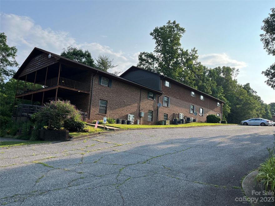 Rare opportunity to own 16 unit apartment complex, a fourplex, a small home on a 6 acre tract right outside of downtown Valdese.