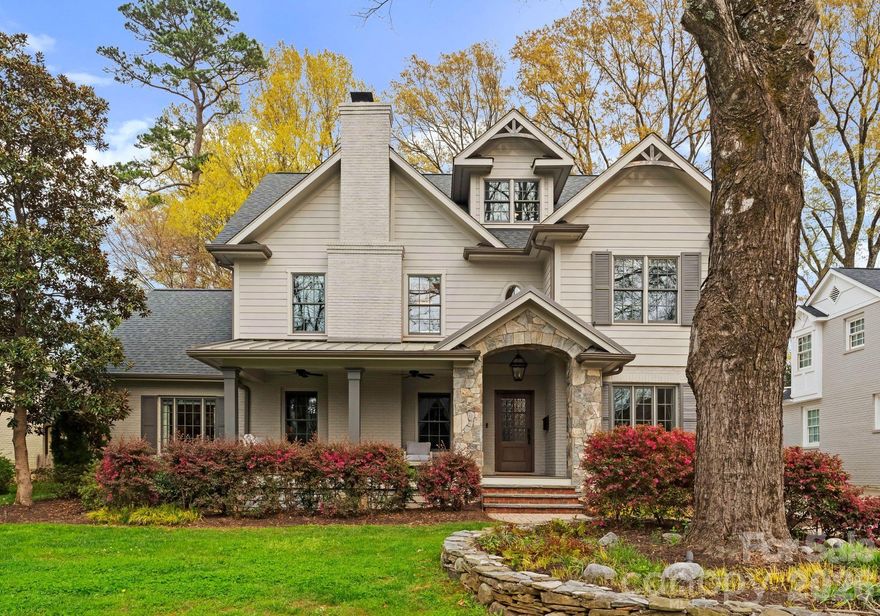 Impeccably renovated in the heart of Myers Park, this 1950 classic perfectly fuses timeless architecture with contemporary luxury.

Distinguished by high-end finishes, designer fixtures, and sophisticated craftsmanship throughout, this residence exudes elegance from the moment you arrive. A gracious covered front porch—accented by ceiling fans and generous seating areas—sets the tone for Southern charm refined to perfection. Inside, an inviting foyer opens to a grand formal living room with a stately fireplace, ideal as a gathering space, home office, or music room. Across the foyer, the formal dining room blends seamlessly with the culinary heart of the home through a beautifully appointed butler’s pantry.

The designer kitchen commands attention with an oversized island featuring a farmhouse sink, quartz countertops, and counter-to-ceiling white subway tile. A suite of premium KitchenAid stainless appliances includes a 48-inch gas range with six burners, a griddle, and double convection ovens, complemented by a 48-inch built-in refrigerator. A thoughtfully designed drop zone enhances the flow of everyday living.

The adjacent family room offers an effortlessly elegant open-concept design with a striking fireplace and a cozy office nook, while French doors extend to an expansive outdoor living area—perfect for hosting or relaxing.

The primary suite on the main level is a sanctuary of calm, with elevated ceilings, a spa-inspired ensuite featuring dual vanities, a soaking tub, and a separate glass shower. The adjoining custom wardrobe room and private laundry space create unmatched convenience.

The second level features a loft ideal for reading or leisure, three spacious bedrooms with two bedrooms sharing a Jack-and-Jill bath and multiple sinks, while the 3rd bedroom adjoins the guest bathroom, plus an additional laundry room with storage. The uppermost 3rd level offers remarkable flexibility as a fifth bedroom, studio, or bonus retreat, complete with a half bathroom.

Outdoor living shines with a covered patio cooled by ceiling fans, a firepit area, and ample room for grilling or al fresco dining beneath the canopy of Myers Park’s renowned mature trees.

Perfectly located for those who value convenience and community, residents enjoy proximity to gourmet markets, boutique shopping, fine and casual dining, the Little Sugar Creek Greenway with access to Park Road Shopping Center and Freedom Park, plus nearby Myers Park Country Club golf and tennis.

This is Myers Park living at its finest—where timeless elegance meets modern luxury in one of Charlotte’s most treasured neighborhoods.
