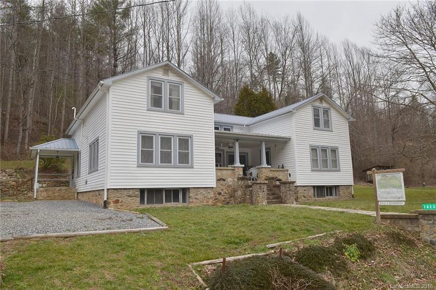 Unique home with 1930's character.  Remodeled and updated.  Designed perfectly for large family or retreat get-a-way.  Most rooms have private bathrooms. Living room with bio-fuel fireplace insert, huge kitchen and dining room - perfect for large gatherings.  Master on main with one other bedroom. Additional rooms, 3 baths and large gathering area finish out the second level.  Enclosed back porch with hot tub and covered front porch are ideal relaxing spots!  Creek on property, just across road.