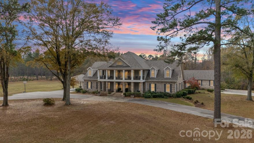 Amazing opportunity to own a bed and breakfast or event venue in Kershaw! Minutes from Carolina Motorsports Part. DOES NOT REQUIRE REZONING Discover an uncompromising level of Southern luxury in this extraordinary 10,000+ sq ft estate set on 10 peaceful and private acres in Kershaw, ideally positioned between the historic charm of Camden and the convenience of Lancaster. A beautifully designed circle drive—finished with elegant pavers at the entrance—guides you past the stately port-cochère and into this distinguished residence, accompanied by three complementary structures: an all-brick workshop, a classic barn, and a charming outbuilding.
Inside, sophistication unfolds across expansive living spaces, where refined craftsmanship and timeless architectural details create an atmosphere of quiet grandeur. The home boasts three full kitchens in the main house and multiple laundry rooms, offering unmatched convenience and versatility for hosting, multigenerational living, or everyday ease. Three distinct wings provide flexibility for guests, private offices, or creative spaces, while a private in-law suite features its own garage and separate entrance for added independence.
The primary suite is a sanctuary of its own, complete with a private library and luxurious his-and-hers bathrooms, each thoughtfully designed for ultimate comfort and indulgence. The dramatic foyer, framed by soaring ceilings, features a light lift providing effortless access to the chandelier—a refined touch perfectly suited to an estate of this caliber.
Outdoor living takes center stage. A sparkling, heated, and chlorinated pool is complemented by an impressive pool house offering a full kitchen, full bath, wood-burning fireplace, and outdoor shower. Beneath the pool house, a pull-through garage adds both convenience and functionality. Multiple screened-in porches invite seamless indoor-outdoor living throughout the seasons.
This remarkable property features 8 bedrooms, 9 full bathrooms, and 2 half baths, ensuring ample space for family, guests, and hosting in complete comfort. The home is further enhanced by numerous recent upgrades, including a new roof (2025), six HVAC units (two from 2020, one from 2021, one from 2022, one from 2025, and the pool house unit from 2009), and five water heaters—three tankless units from 2020 and two 40-gallon electric water heaters from 2009.
Please note: the property’s well pump is not currently operational.
A rare offering of privacy, craftsmanship, and timeless Southern elegance, this estate is more than a home—it is a lifestyle, a retreat, and a legacy. Due to limited photos in MLS, ask your agent for an unbranded link to view all photos.