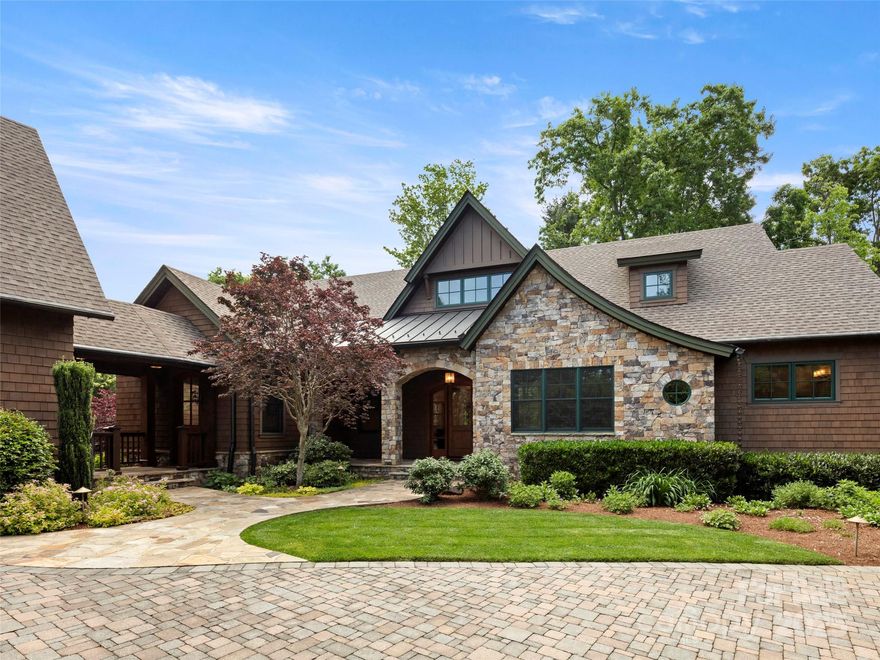 A circular driveway welcomes you to this updated mountain retreat, which is available furnished. Inviting design and serene finishes, such as white oak floors, modern lighting and a light palette set an elegant tone.  Abundant windows allow natural light throughout the house all day long.  The newly updated kitchen is highlighted by a La Cornue induction range and hood, Sub-Zero refrigeration, large quartz island, coffee station, wet bar and oversized pantry.  Enjoy total privacy surrounded by mature landscaping, while relaxing on the screen porch or rear deck.  The terrace level features an entertainment kitchen with Sub-Zero wine storage and an expansive family room that opens to a patio and stone firepit.  Gardeners will enjoy the cedar-paneled potting shed with French doors that open to a convenient cutting garden.  This home has exceptional character, is easy to live in and share with family and friends.
