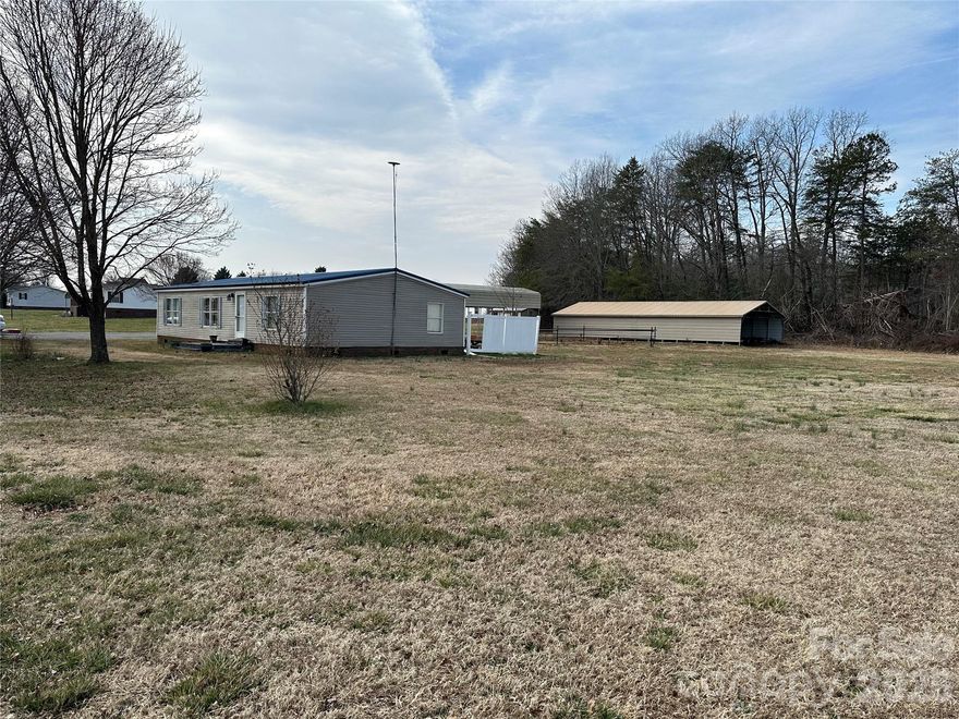 Nice 3 bed, 2 full bath double wide manufactured home. Fully updated 5 years ago. Fans in all bedrooms and in living room. Outside in the garage is a shop with a car lift. Three front doors and two more Bay Area’s in the back. Almost one acre of flat land already cleared. There is RV or boat storage car port and another car port in the back that can hold twelve cars but can use it or something else. Also a shed in the back and a pool that needs a liner. There is a pool system under well cover next to pool. Large yard area on right side of house. 45 minutes from Charlotte, 20 from Denver and Hickory. 35 minutes from Gastonia and Mooresville. 30 mintues from Lake Norman and Lake Hickory.