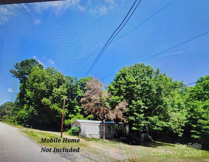 Attention Investors!  Nice buildable lot with electric, water & septic already connected.   Containing .67 acres, this lot can be subdivided one time.  Subdividing can't be done on the road frontage.   This partially cleared lot is almost ready for a new home or Modular (no mobile homes per updated zoning) There is an older Mobile Home currently located on the lot AND IS NOT included with the sale and is not owned by Seller.  Lot is currently rented out by Seller.  Please call for more details.  Appointment is required for ALL showings.  Seller will review all reasonable offers.