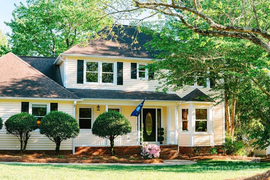 Welcome to this beautifully updated home on a ½ acre in the established Friendfield neighborhood—a rare find combining the charm of a mature lot with modern renovations. Kitchen has updated appliances - 2021 oven and 2023 microwave and pantry. The flexible floorplan includes a main-level guest suite/media room with full bath—ideal for in-laws, office, or bonus space. Upstairs features spacious bedrooms and two redesigned bathrooms with high-end tile, Delta fixtures, and custom cabinetry. Additional updates include 2025 carpet and paint, 2023 HVAC & split unit in Bonus room, 2025 water heater, crawlspace remediation, and more. Garage includes additional attic space. Step outside to a rebuilt deck with market lighting, a fenced yard with mature trees, and no HOA. Just minutes from downtown Fort Mill and Indian Land, and zoned for top-rated Fort Mill schools—this one checks all the boxes!