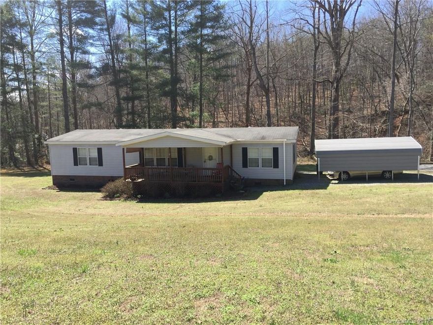 3BD/2BA with covered front porch to welcome you into an open floor plan. Spacious family room with dining area with sliders to the covered back deck, kitchen with breakfast area, and separate laundry room! Master bedroom with walk-in closet, and master bath with garden tub, separate shower, and double vanities. The other 2 bedrooms are a good size. Hall full bath with tub/shower. PRIVACY with a creek on 2 sides! Double metal carport. A must see!