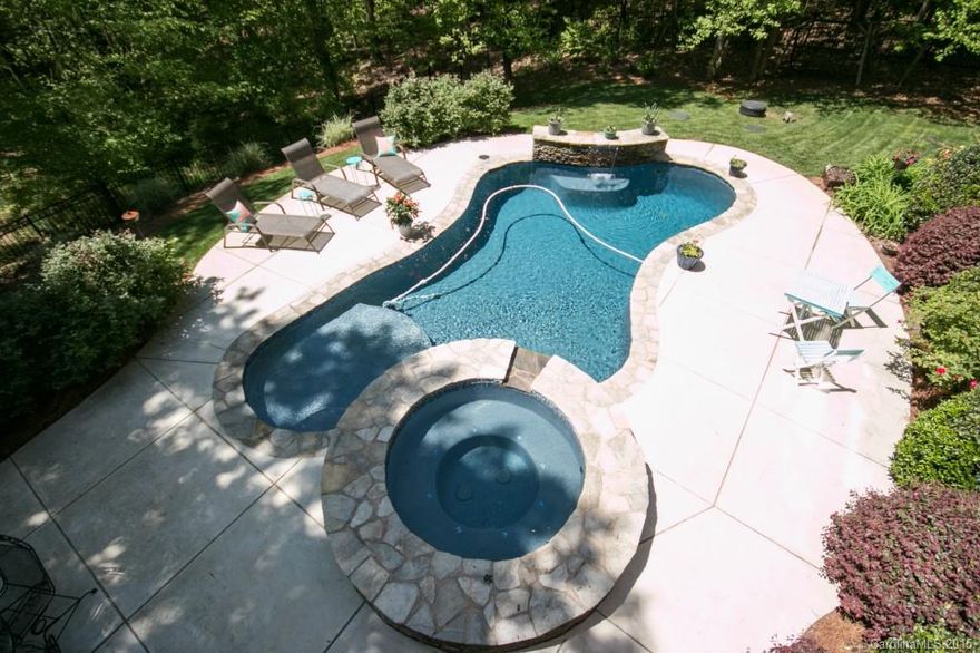 Custom Built Home w/Deeded Boatslip on Private Lot w/Gorgeous Outdoor Living Area! Enjoy entertaining around your In-ground pool w/Hot tub & Outdoor FP + Built-in Grill. Spacious Kitchen w/Commercial Grade SS Appls, Lg Master w/2 Customized Walk-in Closets. Lower Level 2nd Living Quarters features 2nd Kitchen/Bar,Great Rm,Exercise Rm/Media. Storage galore! Community Clubhouse, Swim/Tennis, Boat Ramp, Playground and many Social Events. Membership available to nearby Trump Nat'l Golf-Charlotte.