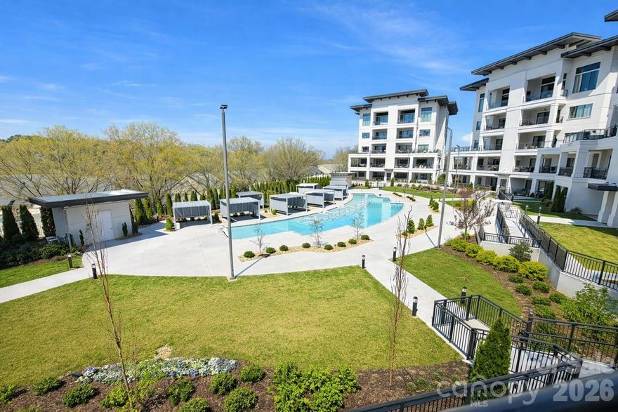 Experience elevated living at Watermark Lake Norman Luxury Condos, ideally situated just 30 minutes from Uptown Charlotte and Charlotte Douglas International Airport, with convenient access to nearby restaurants, shopping, and marinas.

This beautifully appointed condo showcases an open-concept floor plan designed for both comfort and entertaining, seamlessly connecting the kitchen, dining, and living areas. The chef’s kitchen features high-end appliances, stunning cabinetry, and rich wood flooring. The spacious living room is highlighted by a gas fireplace, creating a warm and inviting focal point.

Residents enjoy an array of resort-style amenities, including:

Sparkling community pool with sun deck,
Gym,
Putting green,
Pickleball court, and
Dog park

The community also offers a clubhouse-style gathering space complete with a bar, seating area, pool table, and kitchenette—perfect for hosting or relaxing. Just outside, a covered outdoor space by the pool provides an ideal setting for entertaining or enjoying a game of ping pong.

Located in a highly desirable area close to dining, marinas, and everyday conveniences, this property offers the perfect blend of luxury, lifestyle, and location.

Schedule your private showing today and discover all that Watermark has to offer!