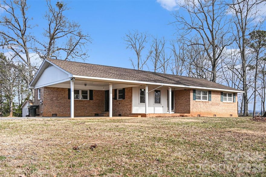 Enjoy seasonal mountain views while remaining close to local restaurants, with easy access to I-85 and just 6.5 miles from the casino, making daily commuting and entertainment convenient. Set on a 0.68-acre lot, this well-maintained 3-bedroom, 2-bath home offers a desirable combination of land, storage, and convenience. Built in 1973, the home features a functional layout with comfortable living spaces and timeless character. The property includes an attached two-car carport, along with two large storage buildings both have electricity! There is an additional smaller storage building, providing exceptional flexibility for hobbies, equipment, workshops, or additional storage.