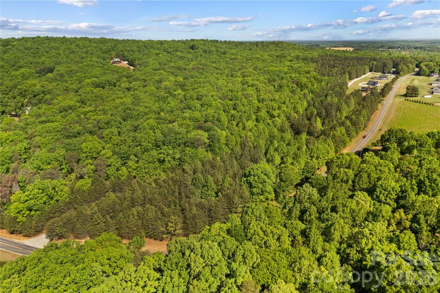 Welcome to a truly rare opportunity to own 2.45 beautiful, wooded acres in the highly sought-after Sherrills Ford area, one of Catawba County’s fastest-growing communities. This generous parcel offers the perfect blend of serene privacy and convenience, providing an ideal setting for your custom estate, private retreat, or investment property. The land is primed and ready for your dream home. It features two separate 3-bedroom passed perc tests already on file with the county, no HOA fees ($0), and minimal restrictions. Situated on state-maintained Mt. Beulah Road, the property boasts an impressive 841 feet of road frontage. Enjoy the ultimate Lake Norman lifestyle just minutes away. You’ll be a short drive from the Long Island Lake Access Boat Launch and other public boat launches, perfect for boating, fishing, and lakeside fun. For recreation, the property is minutes from the 606-acre Mountain Creek Park on Lake Norman, which offers extensive trails, hiking, fishing, and pickleball courts. This location provides easy access to all modern amenities, including shopping, dining, and the new Village at Sherrills Ford. Commuting is made easy with quick access to both Highway 150 and Highway 16, connecting you conveniently to Charlotte and Hickory while still enjoying the quiet charm of this growing area.
Don’t miss out on securing this spacious, private lot close to all that Lake Norman has to offer. Bring your builder and start planning your future today!