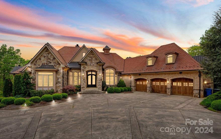 Welcome to an exquisite oasis of luxury living at this majestic mansion nestled on 12 acres of pristine land. As you approach through the gated driveway you are greeted by the grandeur of this estate boasting high-end finishes & unparalleled craftsmanship at every turn. This palatial residence offers an impressive blend of elegance & comfort featuring spacious living areas, multiple fireplaces, soaring ceilings & expansive interior windows offering breathtaking views of the surrounding landscape. Gourmet kitchen features top-of-the-line appliances. Primary suite is a true sanctuary, complete w/luxurious en-suite bathroom, private sitting area & balcony overlooking the picturesque grounds. Outdoor amenities abound, lush gardens & multiple patios & terraces perfect for al fresco dining or relaxing in the serene setting. This property is a rare gem that offers the ultimate in privacy and tranquility making it the perfect retreat for those seeking a luxurious lifestyle in a serene setting.