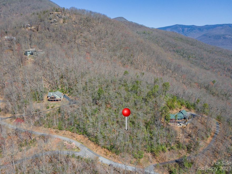 Privacy, layered VIEWS, protection by one of Black Mt's best subdivisions. Scenic proximity to B Mt/Avl downtowns with employment, shopping, recreation, schools, & inc world class arts/crafts, entertainment ctrs. FANTASTIC VIEWS of the Avl Watershed, Swannanoa/North Fork Valleys. Ridge top & ridge point views + lays well for a home & pool! Typically sloped to Sugar Maple & Winding Poplar from ~2,950' elevations but not far inside LR main gate. Get out of your car and take trail provided to ridge & SEE YOURSELF! Many LR amenities, hiking/trails, picnic by river (noisy Laurel Br), LR common areas. THIS LOT BORDERS ~5th largest US "watershed" of 13k acres. Privacy-gated entrance-abundant/diverse wildlife-over 92 neighbors-large timbers/rocky environment! LR's fire sub-station/community center above sub-station provides gathering place for private/community/family activities. LR main gate ~10 minutes (4.2mi from gate) from downtown Black Mountain & ~20-25 minutes from downtown Asheville!