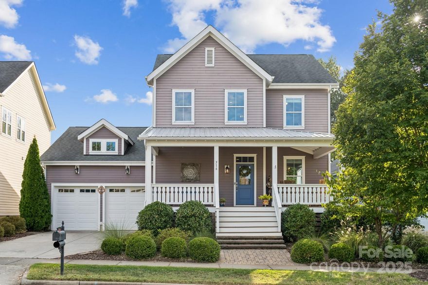 Modern farmhouse charm meets everyday luxury in Riverwalk! Welcome to 516 Jones Mill Lane, a beautifully crafted Evans Coghill-built modern farmhouse tucked away in a peaceful cul-de-sac in the sought-after Riverwalk community of Rock Hill. This 4-bedroom, 2.5-bath home offers 2,665 square feet of thoughtfully designed living space, blending timeless style with contemporary comfort. Step inside to discover site-finished hardwood floors, 9' ceilings, and elegant crown molding throughout the first floor. The open-concept layout centers around a gourmet kitchen featuring granite countertops, large island, stainless steel appliances, a tile backsplash—perfect for entertaining or cozy nights in. The first-floor primary suite is a true retreat, complete with a spacious walk-in closet with custom shelving and a huge luxurious walk-in shower. Upstairs, a versatile loft provides additional living space, ideal for a home office, playroom, or media area. All bedrooms feature custom closet systems, maximizing storage and organization. Enjoy outdoor living year-round with TREX decking on both the extra-large breezy covered front porch and the covered back porch, overlooking a private fenced yard with patio & fire pit that backs up to a serene green space. The irrigation system and 2025 tankless water heater add convenience and efficiency. Located just around the corner to shops, restaurants, and the scenic Riverwalk trail, this home also offers access to community amenities including an outdoor pool with lazy river, clubhouse, park, and BMX track—all within walking distance. Enjoy vibrant living in golf-cart friendly Riverwalk and in one of the best areas of the community! Come see why this home is the perfect place to write your next chapter.