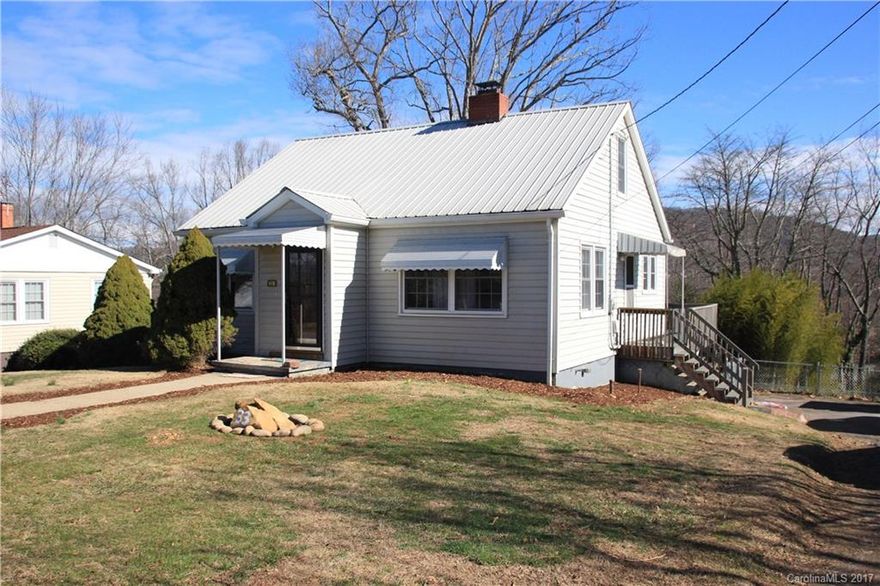 Here's your chance to buy a home in the Woodfin area. Within a short walking distance to new proposed Greenway and the French Broad River park system 
7 minutes to Downtown Asheville. Classic Bungalow with full unfinished basement. Metal Roof. Gas log fireplace.
Pet friendly fenced in backyard with fire pit.
City Water City Sewer. Zoned R-10 for possible vacation rental.