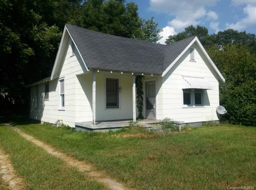 Investment Property. Limited information available. Previously rented for $400 per month. Age of home, lot size and features unknown.  Fireplace closed. Wood Painted floors. Window AC. Gas Furnace. Sold "As-Is, Where-Is". No repairs.  If schools are important please verify, subject to change.