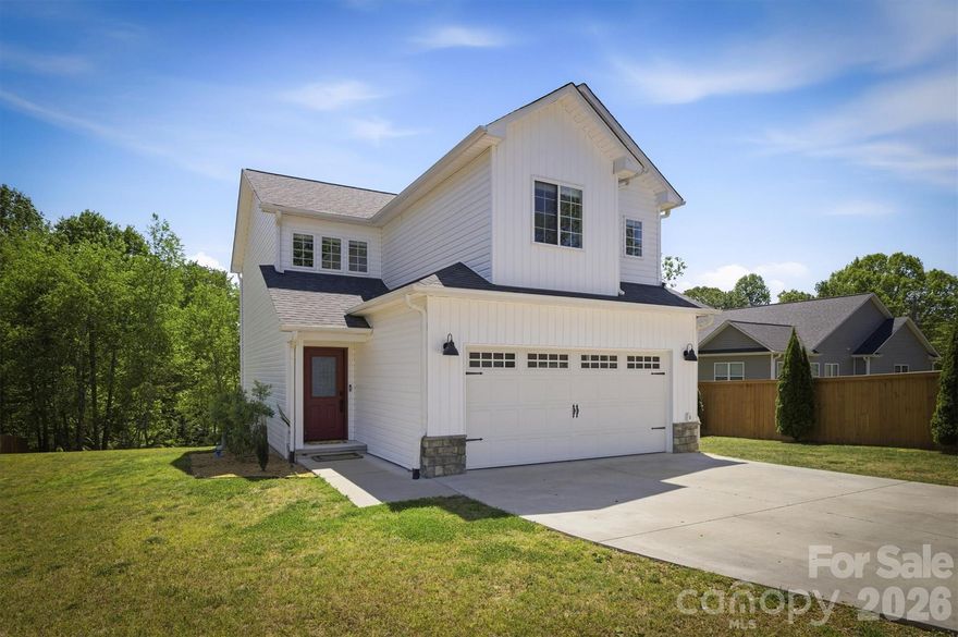 ****Welcome home to this beautifully crafted 2021 Farm House in the heart of Connelly Springs! NO HOA!  Lake life is not far from this 3-bedroom, 2.5-bath home offers bright, open living space designed for the way you actually live. The main level features an open concept with a family room, dining area, half bath, and gorgeous kitchen with white shaker cabinets, quartz countertops, and stainless steel appliances — perfect for entertaining. Upstairs, you'll find a private primary suite with a full bath, plus two additional bedrooms, 2nd  full bath, and a convenient upper-level laundry. Step outside to your rear deck overlooking a cleared lot with a fire pit and garden. Home features a 2-car attached garage, concrete driveway, public water and sewer..  Sellers updates: New sliding door, new blinds, new window screens, remodeled primary bath, and painted inside the home.  Near HWY 70 and I-40, giving you quick access to Hickory or Morganton.  Close to the UNC hospital. Boat ramp minutes away.  Schedule your showing today!