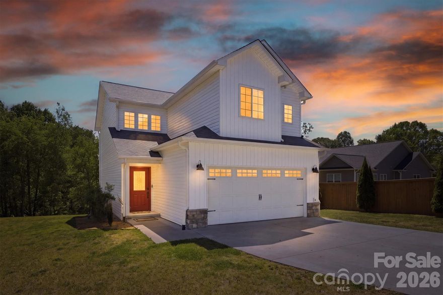 ***Open HOUSE - this Saturday, April 25, from 11 - 1 !  ****Welcome home to this beautifully crafted 2021 Farm House in the heart of Connelly Springs! This 3-bedroom, 2.5-bath home offers bright, open living space designed for the way you actually live. The main level features an open concept with a family room, dining area, half bath, and gorgeous kitchen with white shaker cabinets, quartz countertops, and stainless steel appliances — perfect for entertaining. Upstairs, you'll find a private primary suite with a full bath, plus two additional bedrooms, 2nd  full bath, and a convenient upper-level laundry. Step outside to your rear deck overlooking a cleared lot with a fire pit and garden. Home features a 2-car attached garage, concrete driveway, public water and sewer, and NO HOA.  Sellers updates: New sliding door, new blinds, new screens, remodeled primary bath, and painted inside of home.  Home is conveniently located near HWY 70 and I-40, giving you quick access to shopping in Hickory or Morganton.  Schedule your showing today!