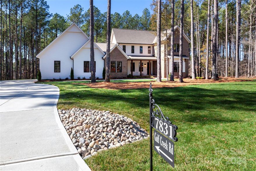 Situated on a secluded, wooded private lot in Riverchase Estates, sits an exquisite build by Commonwealth Custom Homes in collaboration with elite architect, Bassett Homes. Living room has custom milled white oak mantle, complementing brick faced fireplace. Kitchen with custom designed cabinetry has unique features like a rising appliance shelf.  Dining room accented by judges panel wall. Multipurpose nook off kitchen. Butler’s pantry with glass front cabinets, beverage fridge & ice maker. Laundry room with sink. Hall tree with extra storage. Garage pre-wired for 2 EV chargers & golf cart charging. Screened in porch with fireplace that has milled pecan mantle. Main level owners suite with soaking tub and zero entry shower. Custom vanity with salon cabinet for hairdryer, irons, etc. Upstairs bonus room with built in bar. Home pre-wired for Sonos sound system.  Site finished hardwood floors & tile throughout. Irrigation system & landscape lighting. Owner is a real estate agent in NC.