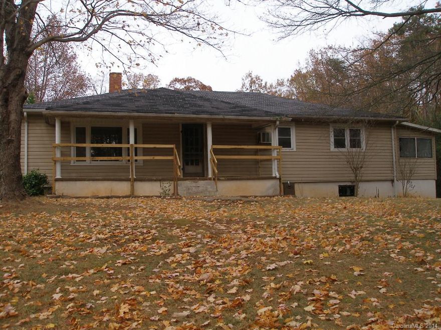 Vinyl sided older home with very private location on no through street on 1.18 acre lot wooded on 2 sides. Covered porch overlooks spacious side yard. Large kitchen, heated enclosed back porch, concrete floored cellar with oil furnace and electric water heater.   Note: stay off the deck as it is unsafe.