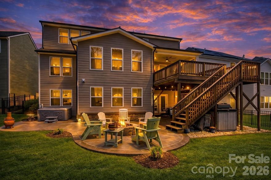 Luxury Living with Ultimate Flexibility in Paddlers Cove and minutes to Charlotte, NC!

Welcome to a residence where refined design meets unparalleled scale. Nestled in the heart of Lake Wylie within the highly sought-after amenity rich Paddlers Cove community, this 2022-built "Stonehaven" model by DRB Homes is more than just a house—it’s a sanctuary designed for the modern, multi-generational family and is ready for your family or relocation!  

The Main Level: Sophistication & LightStep through the foyer and into an open-concept masterpiece. The gourmet kitchen is a chef’s dream, featuring quartz countertops, a massive sitting island, a 5-burner gas cooktop, and a stylish butler’s pantry leading to the formal dining room. The sun-drenched family room, anchored by a cozy fireplace, flows seamlessly into a vaulted morning room—perfect for your early coffee while overlooking the wooded backyard.Accommodations & Private Suites

The Primary Retreat: Located upstairs, this massive suite features a tray ceiling and a spa-like deluxe bath with dual vanities, a deep soaking tub, and a semi-frameless glass shower

Secondary Living Quarters: A rare find! The full finished walk-out basement serves as a private living suite, complete with its own separate entrance, full kitchen, living room, bedroom, and full bath. It’s the ideal setup for in-laws, long-term guests, or an elite entertainment hub.

Work & Play: A dedicated home office with French doors provides the quiet you need for remote work, while the upstairs loft offers a secondary gathering space for the kids.

Your Outdoor Oasis

Step outside to your extended 20-foot covered deck or the lower-level patio to find a fully fenced, tree-lined backyard. After a long day, unwind in the above-ground hot tub or gather around the fire pit for s’mores under the stars.  Living here means more than just a beautiful home; it’s about the community amenities: Two sparkling community pools & clubhouse.Direct Lake Wylie access and walking trails.  A golf cart away from Field Day Park (pickleball, sports fields, and playgrounds).  On and near cul-de-sac, low traffic, private backyards. 

Zoned for the award-winning Clover School District (Crowders Creek Elementary is right around the corner!). This property stands out not just for its size, but for its versatility. Minutes from restaurants, local activities, shopping, grocers, and a short drive in to the NC border!

The separate living quarters in the basement are a game-changer for families relocating with extended relatives. 

Plus, with a low VA/FHA assumable interest rate (5.375%) available, this is a strategic financial opportunity you won't find every day.

Key Property Features at a Glance:
Multi-generational living
Built: 2022 (Like-New Construction)
Square Footage: 5,446 (Total Living Area)
Lot: 0.19 Acres (Cul-de-sac, Fenced, Wooded View)
Parking: 2-Car Garage + 4 Driveway Spaces
Extras: Dual laundry rooms, 2 kitchens, wet bar, fiber-optic internet ready.