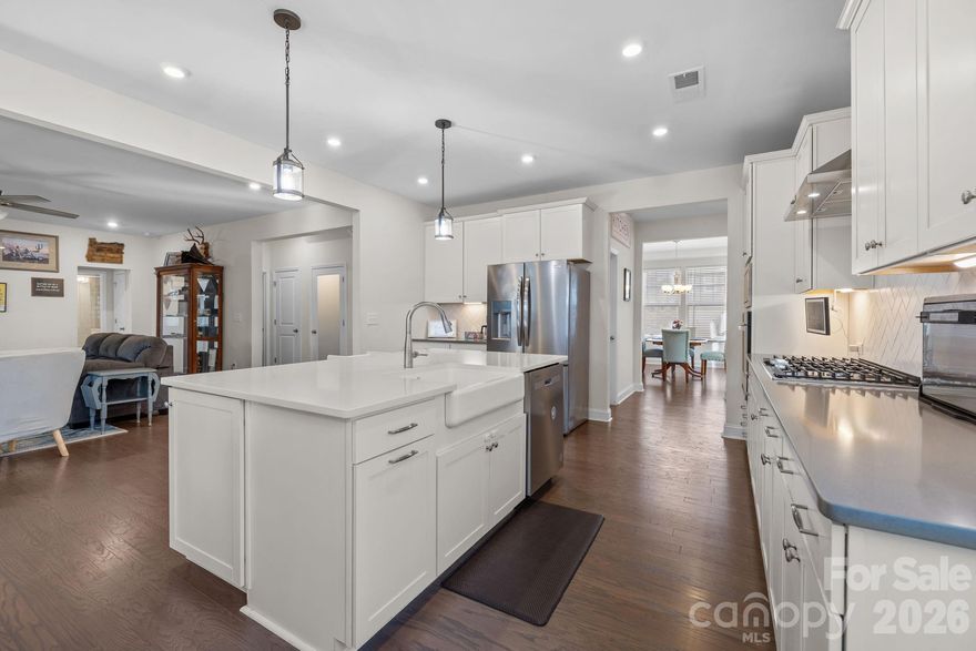 Luxury Living with Ultimate Flexibility in Paddlers Cove and minutes to Charlotte, NC!

Welcome to a residence where refined design meets unparalleled scale. Nestled in the heart of Lake Wylie within the highly sought-after amenity rich Paddlers Cove community, this 2022-built "Stonehaven" model by DRB Homes is more than just a house—it’s a sanctuary designed for the modern, multi-generational family and is ready for your family or relocation!  

The Main Level: Sophistication & LightStep through the foyer and into an open-concept masterpiece. The gourmet kitchen is a chef’s dream, featuring quartz countertops, a massive sitting island, a 5-burner gas cooktop, and a stylish butler’s pantry leading to the formal dining room. The sun-drenched family room, anchored by a cozy fireplace, flows seamlessly into a vaulted morning room—perfect for your early coffee while overlooking the wooded backyard.Accommodations & Private Suites

The Primary Retreat: Located upstairs, this massive suite features a tray ceiling and a spa-like deluxe bath with dual vanities, a deep soaking tub, and a semi-frameless glass shower

Secondary Living Quarters: A rare find! The full finished walk-out basement serves as a private living suite, complete with its own separate entrance, full kitchen, living room, bedroom, and full bath. It’s the ideal setup for in-laws, long-term guests, or an elite entertainment hub.

Work & Play: A dedicated home office with French doors provides the quiet you need for remote work, while the upstairs loft offers a secondary gathering space for the kids.

Your Outdoor Oasis

Step outside to your extended 20-foot covered deck or the lower-level patio to find a fully fenced, tree-lined backyard. After a long day, unwind in the above-ground hot tub or gather around the fire pit for s’mores under the stars.  Living here means more than just a beautiful home; it’s about the community amenities: Two sparkling community pools & clubhouse.Direct Lake Wylie access and walking trails.  A golf cart away from Field Day Park (pickleball, sports fields, and playgrounds).  On and near cul-de-sac, low traffic, private backyards. 

Zoned for the award-winning Clover School District (Crowders Creek Elementary is right around the corner!). This property stands out not just for its size, but for its versatility. Minutes from restaurants, local activities, shopping, grocers, and a short drive in to the NC border!

The separate living quarters in the basement are a game-changer for families relocating with extended relatives. 

Plus, with a low VA/FHA assumable interest rate (5.375%) available, this is a strategic financial opportunity you won't find every day.

Key Property Features at a Glance:
Multi-generational living
Built: 2022 (Like-New Construction)
Square Footage: 5,446 (Total Living Area)
Lot: 0.19 Acres (Cul-de-sac, Fenced, Wooded View)
Parking: 2-Car Garage + 4 Driveway Spaces
Extras: Dual laundry rooms, 2 kitchens, wet bar, fiber-optic internet ready.
