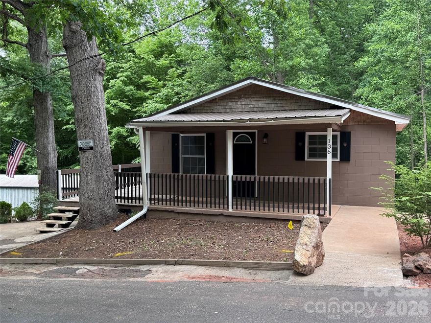 Rare opportunity to own your own mini real estate empire in Rutherfordton. The main home features solid cinder block construction topped with a durable metal roof and has been thoughtfully updated with recent renovations. Vaulted ceilings highlight the main level, along with an open concept kitchen and living area finished with LVP flooring. Two bedrooms and a full bathroom with tile finishes are also located on the main level. Each level of the home is equipped with its own new mini split system for efficient comfort.

The basement level includes a walk in laundry room and additional space that could be finished into a bedroom or second living area. A toilet is already in place in the bathroom area, leaving the rest ready for your customization. Seller is including select building materials to help complete your vision.

Adding to the income potential, a single wide manufactured home currently sits on the property with a lot rent of 400 per month. The home is not owned by the seller and can remain or be removed based on buyer preference. The two residences share a 1500 gallon septic system that was pumped in May 2025, and each has separate power, water, and gas meters.

To the right of the main home is an additional homesite where a residence once stood, offering even more potential for expansion. Across the road, approximately 0.44 acres is included with the parcel and provides further possibilities for building or investment.

Conveniently located just moments from Rutherford Regional Health System with easy access to Highway 108 and 221, this property offers flexibility, income potential, and room to grow.