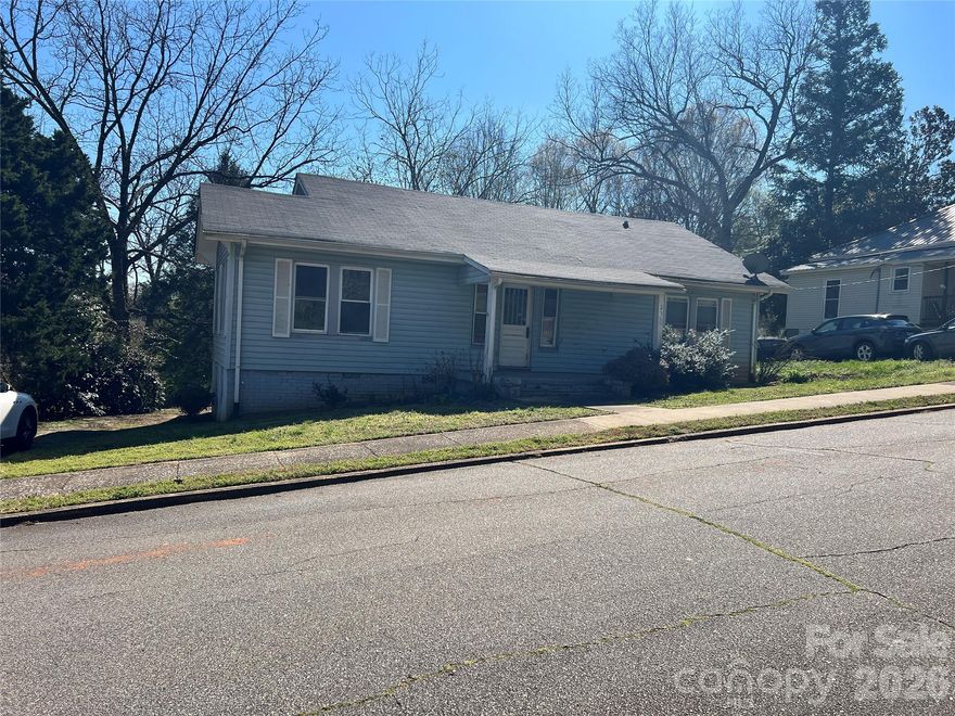 Calling all investors! Excellent opportunity with large, open lot of 0.8 acres located within walking distance of downtown Rutherfordton. The property started renovations, but unfortunately, they were halted due to Hurricane Helene. Roof is less than five years old, and the interior has been gutted, requiring new electrical, HVAC, and plumbing systems. The bathroom and kitchen have been partially started, new vinyl flooring and a new walk-in shower. Owner is real estate agent. Buyer to verify all information, agent makes no representations due to never occupying home.