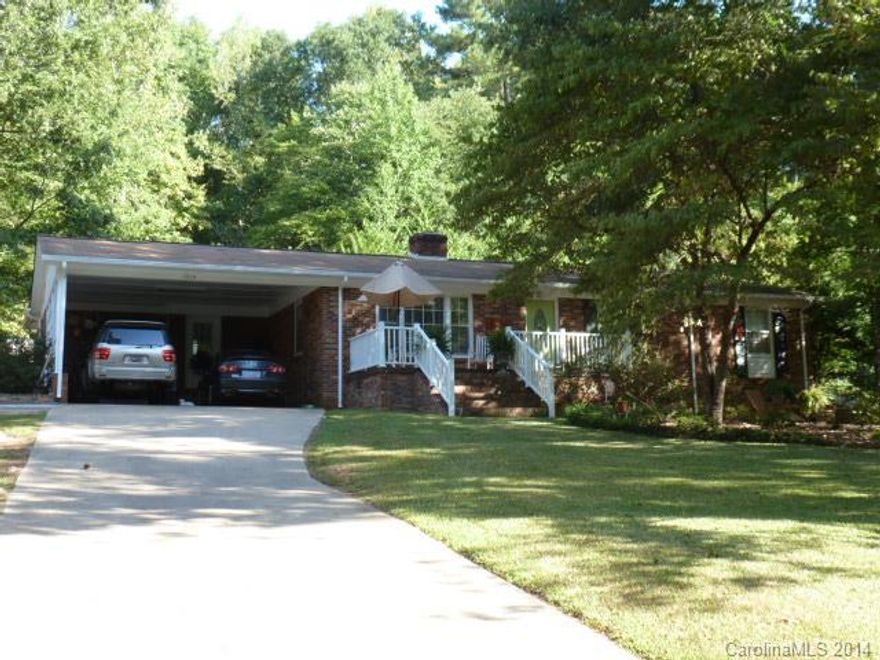 Total UP DATE describes this home. There is not one part of this home that has not had a new look. A very warm home, as you walk up the steps to a new porch and deck. Beautiful hardwoods throughout the home with carpet in the master BR.The Great room is where you want to just sit back and take it easy in front of the open fire place. Opens to the large back yard and brick patio.