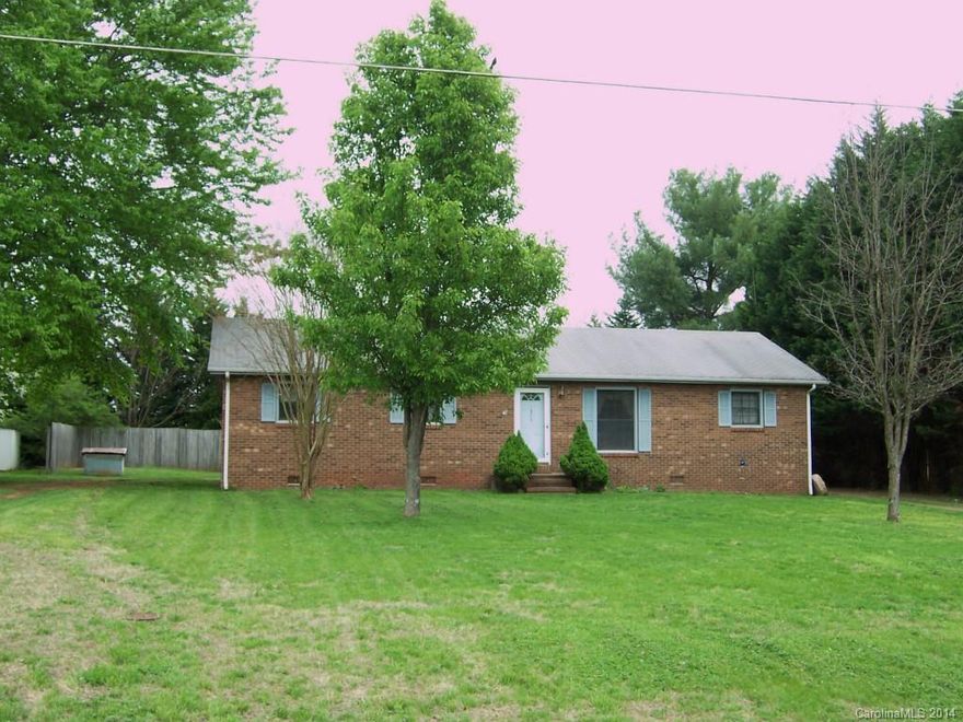 LOT OF HOUSE for the $$. Separate MBR, kitchen/dining combo. Heatpump, all electric. Circle drive, level yard.  2 older buildings in rear of home.  Some rooms newly painted. Close to shopping and hospital.  1/2 mile from I-40 access. Well maintained home and neighborhood.