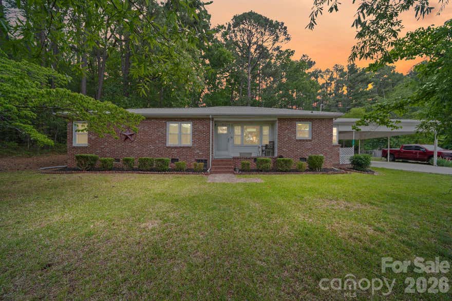 Welcome home to this charming brick ranch nestled in the heart of Mount Gilead! Featuring 3 bedrooms and 1.5 baths, this well-maintained home offers beautifully refinished hardwood floors throughout, adding warmth and timeless character to every room. Situated on a large level lot, the fully fenced backyard provides plenty of space for pets, play, gardening, or entertaining. Enjoy the convenience of an attached carport and a location that’s hard to beat — right beside Stanback Park, a 15-acre community park featuring a public pool, walking trails, picnic areas, pickleball courts, and tennis courts. Plus, you’re just minutes from the shops, dining, and small-town charm of downtown Mount Gilead. Whether you’re looking for your first home, downsizing, or simply wanting a move-in ready property in a great location, this one is a must-see!