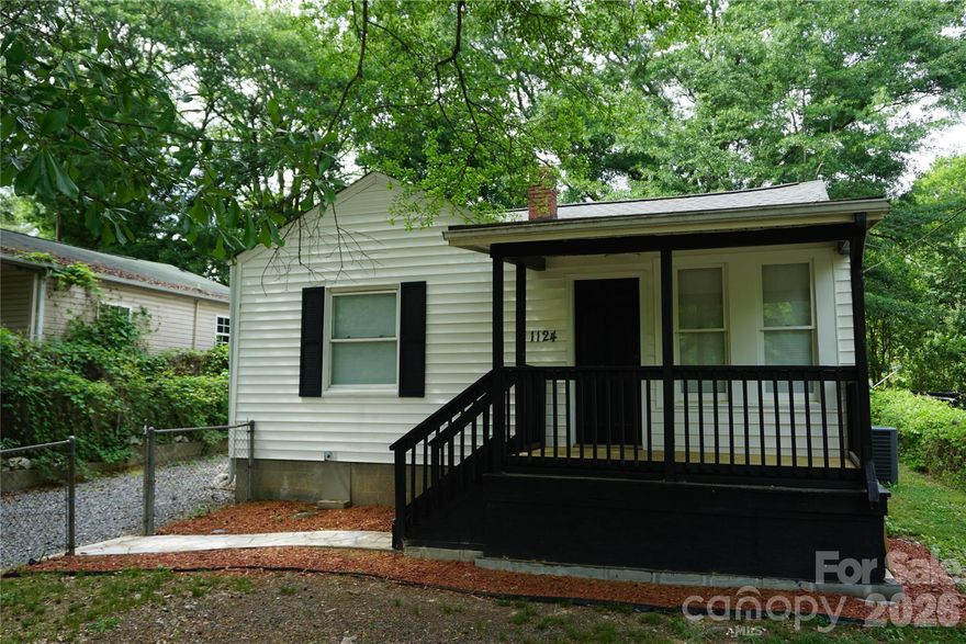 This charming, newly renovated home blends modern updates with cozy character, offering move-in-ready convenience. Featuring a brand-new HVAC system and updated ductwork for year-round comfort, the home also boasts fresh finishes throughout, including updated flooring, paint, and fixtures. The inviting front porch adds curb appeal and a perfect spot to relax, while inside you’ll find bright, open living spaces filled with natural light. The stylish barn door adds a touch of rustic charm, and the functional layout flows seamlessly into the kitchen and adjoining areas. Nestled in a peaceful setting with mature trees, this home is an excellent opportunity for buyers seeking quality updates and timeless appeal.