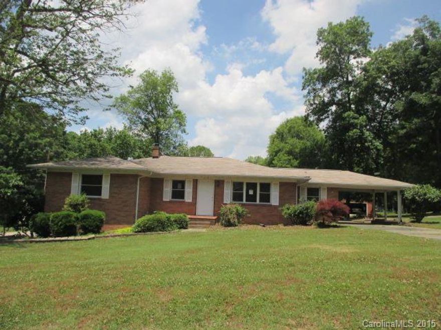 Full brick home features 4 bedrooms, 2 baths, kitchen, and living room. Features include ample kitchen cabinet spaces, some neutral colors, a carport, and  2 car attached garage. Home large deck perfect for entertaining guests.