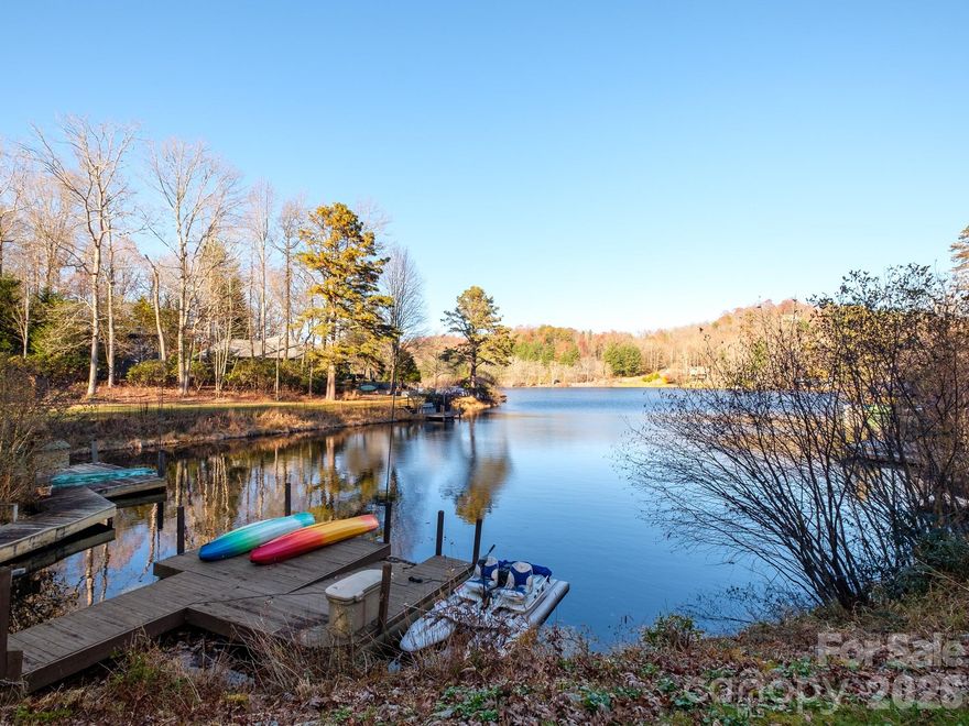 Tucked at the end of a quiet cul-de-sac, this beautifully maintained 4BR/3BA lakefront home offers an exceptional blend of comfort, craftsmanship, and year-round mountain living. The totally flat driveway, oversized detached garage, and huge lower-level storage/workshop create everyday ease the moment you arrive.

Inside, vaulted ceilings and a striking stone fireplace anchor the main living area, where natural light and serene lake views flow through nearly every room. The open kitchen and dining spaces connect seamlessly to expansive decks, including an inviting outdoor fireplace and a hot tub. The main level provides true one-level living, while an upper-level primary suite offers added privacy and a balcony overlooking the peaceful waters of Lake Atagahi.

Outdoors, the home is designed for connection to the lake, to the forest, and to the active lifestyle Connestee is known for. Multiple decks, generous porch space, and a private dock on the water create endless opportunities for gathering, unwinding, or simply watching the seasons change. 

Located just minutes from the East Fork Gate, this property offers quiet seclusion with easy access to town. Within Connestee Falls, you’ll enjoy miles of hiking trails, championship golf, pickleball and tennis courts, and a vibrant clubhouse scene that brings neighbors together.

42 Gvli Drive is a rare combination of privacy, lakefront living, and thoughtful design in one of Brevard’s most cherished communities. Schedule your private tour today.