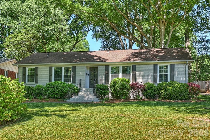 Charming Montclaire brick ranch nestled under a canopy of towering shade trees, complete with a fenced, park-like backyard that’s perfect for entertaining or relaxing! Step inside to a welcoming foyer and a sunken living room, both featuring gleaming hardwood floors. The updated kitchen shines with Kraftmaid maple cabinets, sleek Quartz countertops, and contrasting black appliances, creating a stylish yet functional space. The vaulted family room steals the show with its stunning stone fireplace and easy access to the backyard.

This home offers three updated tiled baths, including a half-bath in the primary bedroom, a hall bath, and a second full bath conveniently located off the family room. You’ll also adore the cozy sun porch—ideal for morning coffee or evening unwinding—and the tiled laundry room with ample storage. Recent updates, including painted brick, new windows, and a gardening shed, add to the home’s appeal.

Located near the Greenway in Charlotte, you’ll enjoy easy access to outdoor recreation while being just minutes from SouthPark’s premier shopping and dining, Uptown, and the Light Rail. This is the perfect blend of charm, comfort, and convenience—don’t miss it!
