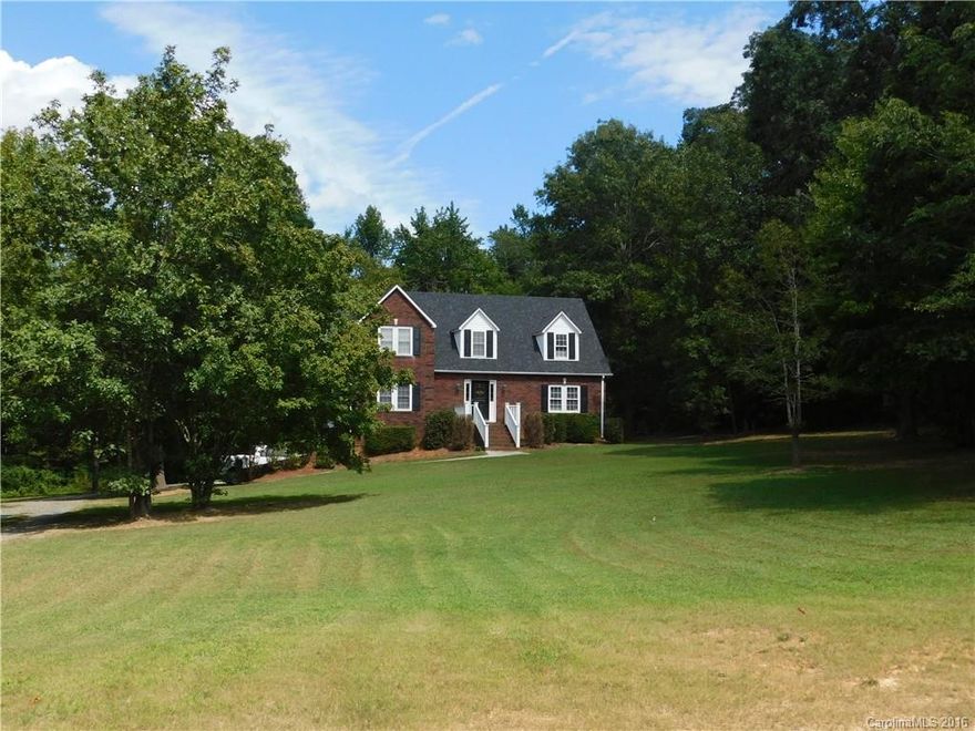 I invite you to to check out this home located 2.54 acres in the beautiful country of Mount Pleasant. Almost 3000 heated sq feet. Large master suite on the main floor with a spacious living room. Kitchen with granite counter tops, bar and dining area. Nice laundry and 1/2 bath. 2 large bedrooms upstairs with a full bath and loft. The basement is finished partial but all is heated and cooled. Nice den, office and work shop. Gorgeous wooded lot on 3 sides that sits back off the road. Call me now!