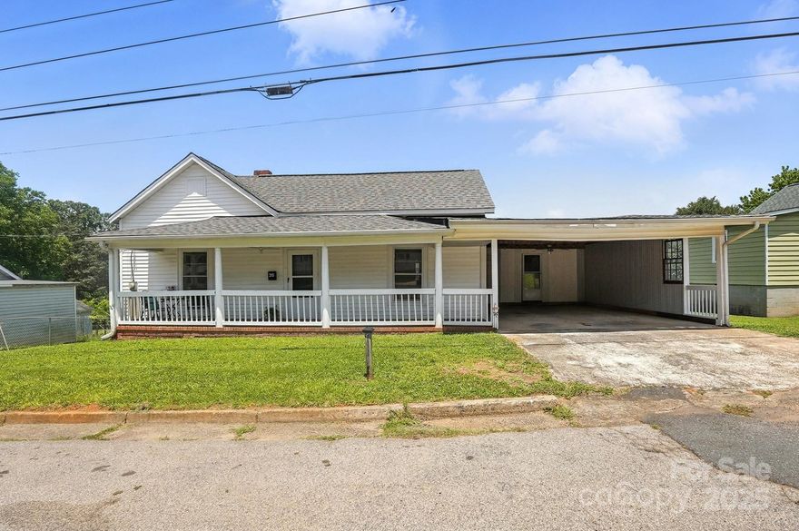 This charming Mill House sits in the Heart of Downtown Fort Mill. There is no HOA. The home offers excellent living space and ample yard. Bring your vision to life here. 

Don’t miss this opportunity to own a spacious, mill house just a block from Walter Elisha Park and the Fort Mill Amphitheater! With over 1,600 sq ft of living space—unusually large for this area—this home offers charm, and endless potential including a detached workshop/ garage space in the rear. 

Enjoy the inviting curb appeal with a classic rocking chair front porch and a side deck. Inside, you’ll find a generous layout featuring a large kitchen, high 9-foot ceilings (visible with the drop panels removed), and a layout ideal for both comfortable living and future renovation. 

The expansive yard offers room to grow, garden, or play, and the 589 sq ft detached garage/workshop adds excellent functionality for hobbyists, storage, or creative projects.

Whether you're a first-time homebuyer, investor, or someone ready to live in while renovating, this is your chance to own a piece of Fort Mill history in an unbeatable location.