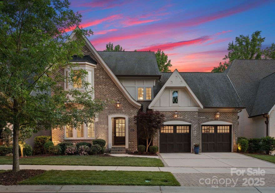 This stunning 3-story executive home in SouthPark features an open floor plan with custom details. The first floor includes a master suite and a chef's kitchen with marble countertops and high-end appliances. The breakfast area opens to a private courtyard with a built-in grill and bluestone countertops.
The great room is ideal for entertaining, offering a coffered ceiling, custom cabinetry, and a tile fireplace. Triple sliding glass doors lead to a covered porch with motorized screens and views of the private backyard, which includes a travertine patio, and a built-in fire table. The second floor offers 4 bedrooms, 2 full baths, and an exercise room. On the third floor, you'll find a bonus room, which offers great flex space that would be perfect for a home theater or game room. This luxury boutique neighborhood is close to upscale shopping & dining destinations, minutes to Uptown and the Airport. This truly is an incredible move-in-ready opportunity that shouldn't be missed.