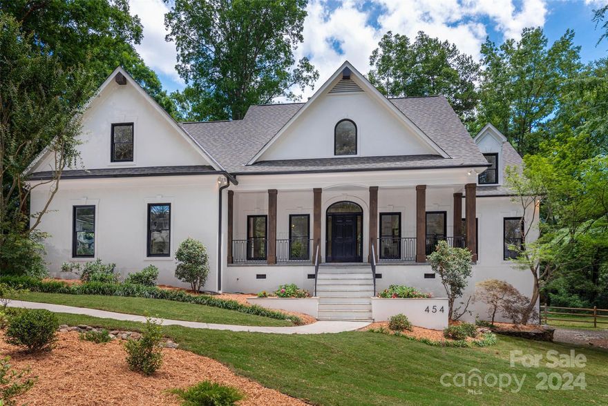 Welcome to this gorgeous Cotswold home on a coveted street. Recently renovated, it offers 0.95 acres for both entertaining & daily living. Enjoy unparalleled privacy on the new outdoor deck in the wooded backyard.  Inside, the 2-level foyer leads to a Great Room w lots of natural light and a stunning floor-to-ceiling, Italian tiled fireplace. The entire interior & exterior are freshly repainted. The kitchen features new quartz countertops, a Viking stove, SS appliances, & a walk-in pantry. New lighting, hardwood floor, & plush carpet throughout enhance the home’s updated appeal. The main level includes a luxurious primary suite w a spa-like bathroom, formal dining, an office, & a half bath. Upstairs, find 3 beds, 2 full baths, and a bonus room (5th bed) w ample storage. The finished basement offers flexible space w new LVP flooring & a showstopper glass garage door, plus a half bath. Discover modern luxury & tranquility in this exceptional Charlotte residence that's move-in ready!