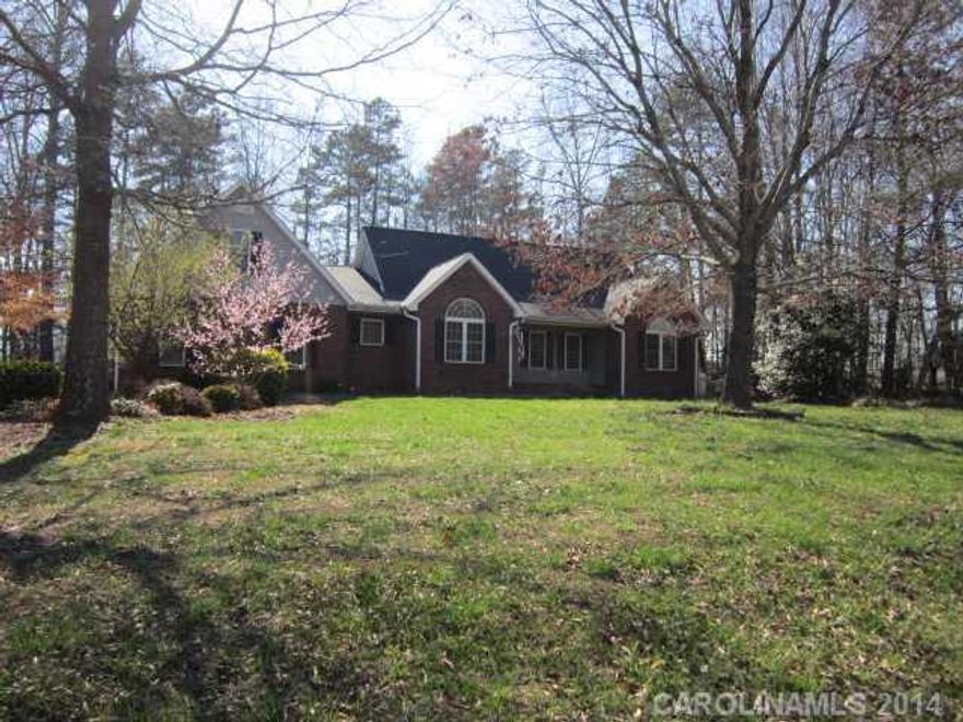 Excellent price at $224,900 Brick w/vinyl trim, sunroom, hardwood floors, nice large front porch, double garage, new carpet, all appliances stay in kitchen and laundry room. Two finished bonus rooms upstairs; Fireplace with gas logs in GR; Corner lot with all kinds of plantings and shrubs; privacy shrubs along Buffalo Shoals Rd. Irrigation system back yard. Wonderful floor plan, screened back porch and sunroom, rocking chair front porch also; Close to Interstate Hwys, shopping, and schools