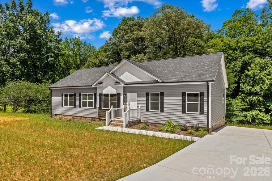 This brand new 3 bedroom, 2 bath home offers 1,835 square feet and an open-concept layout designed for comfortable living. The spacious kitchen features a large island, breakfast bar, pantry, and dining area, flowing seamlessly into the living room. The primary suite includes a walk-in closet and private bath. Additional highlights include a dedicated laundry room on the main level, entrance foyer, and modern finishes throughout. Enjoy outdoor living with a welcoming front porch and rear deck, plus a concrete driveway for easy parking. Situated on 1.05 acres, this new construction home also features vinyl siding, a crawl space foundation, heat pump heating and cooling, public water, and septic installed. Plenty of yard space provides opportunities for outdoor activities. Amazing location that is convenient to shopping, dining, and award-winning schools.