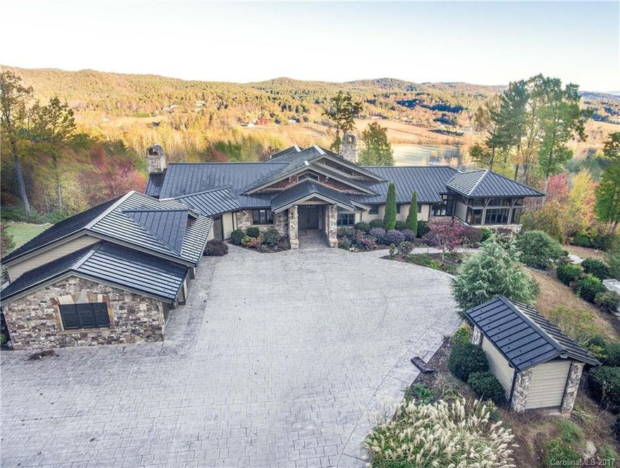 Absolutely stunning mountain estate property. Amazing attention to detail in this very solid home with incredible wood and stonework throughout, and many top-of-the-line finishes and smart systems. More than 47 acres with gentle terrain, only 15 minutes from downtown Hendersonville. Open meadows, fenced for horses, and large naturally spring-fed pond with dock. Really nice 5-stall barn. As-is - Buyer to confirm all. Priced under tax value.