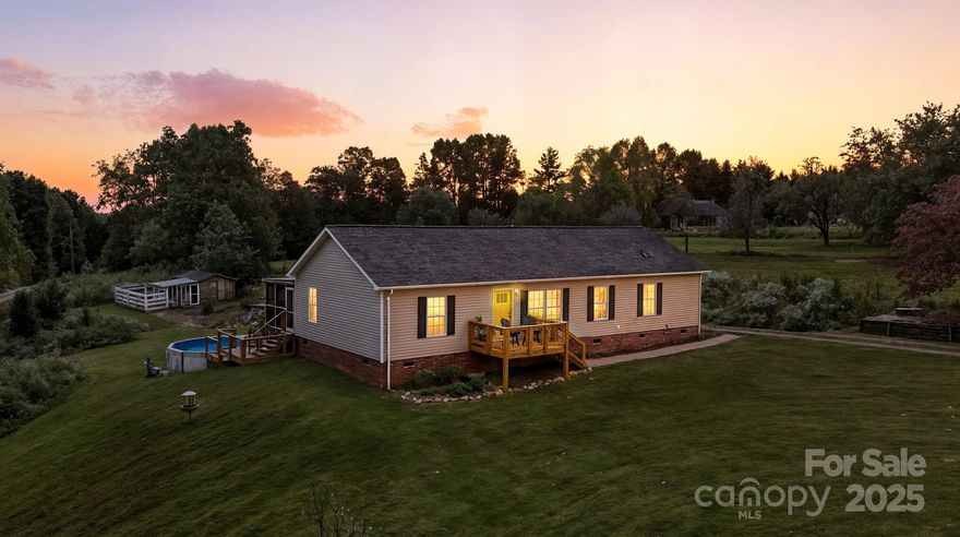 Tucked away in a peaceful rural setting, this 2-bedroom, 2-bath with bonus room home feels like a countryside daydream come to life. Surrounded by wildflowers, fruit trees, and songbirds, every corner invites you to slow down and savor the simple joys of home. The enclosed deck is the perfect perch to enjoy the first glimpses of daylight with your morning coffee or unwind in the evening breeze as the crickets begin their song. An updated front porch welcomes you home, while the like-new above-ground saltwater pool, outbuilding, and chicken coop add charm and functionality to the expansive outdoor space. Inside, discover a home that blends warmth with creativity. The updated kitchen features granite countertops and thoughtful details that make cooking a joy. The primary suite bathroom showcases modern tile work and a large walk-in closet. The home’s artistic touches bring personality and soul to every room. This isn’t just a house — it’s a retreat for the dreamer, the gardener, the artist, or anyone longing for a bit of magic in everyday living. Come fall in love with a home that feels like it was made just for you.