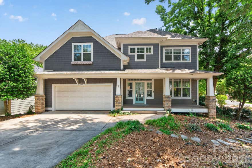 Nestled in the heart of Lake Norman, this beautifully updated Craftsman-style home offers water views and spacious living, plus you're zoned for top-rated schools. Thoughtfully renovated with modern upgrades throughout, the home blends timeless charm with exceptional functionality. The fully renovated kitchen features quartz countertops, an oversized stainless sink with upgraded faucet, white oak cabinetry, soft-close drawers, walk-in pantry, stylish backsplash, reverse osmosis water filtration connected to the refrigerator, new gas stove, and an oversized island with seating for six. A stunning 100-inch kitchen window overlooks the private backyard. New engineered hardwood flooring, carpet, and fresh interior paint complete the interior updates. The great room features vaulted ceilings, wall-to-wall windows, abundant natural light, and a gas fireplace. A main-level bedroom or flex space with nearby full bath offers ideal guest, office, or multi-generational living options. Upstairs, the primary suite includes vaulted ceilings, a walk-in closet, and a fully renovated spa-inspired bath with a freestanding soaking tub and walk-in shower with modern tile finishes. Two additional bedrooms share a Jack-and-Jill bath, while a fourth bedroom or office includes custom built-ins. A spacious bonus room and screened porch offer beautiful Lake Norman views. Outdoor living is designed for entertaining with a new deck, outdoor stone fireplace, two screened porches, raised garden beds, stepping stones, and professionally enhanced landscaping with lavender, trees, and azaleas (2024), and in-ground irrigation. Additional parking provides space for guests or a boat, and the private backyard is surrounded by mature trees. Additional features include a new roof (2024) and Nest thermostat. Located near Lake Norman, this home offers easy access to boating, outdoor recreation, and nearby Charlotte. Residents of Island Forest enjoy HOA lake access and a community boat launch area, making it easy to embrace the very best of lake life. The neighborhood is surrounded by premier dining, boutique shopping, local breweries, and year-round events that make the Lake Norman area one of the region’s most sought-after destinations. Don’t miss this exceptional opportunity - schedule your private tour today!