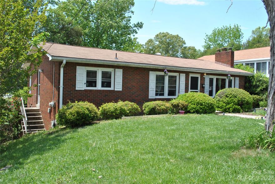 First-time homebuyers, handy dandys, investors, needers of a home. It's close to & within WALKING DISTANCE TO DOWNTOWN HVL AND EVEN CLOSER TO NEW BREWERY (7minutes by foot), going in around the corner on S. Whitted. This home is under 300K! May need some updating, but it's very cute as-is.  Come and make it your own.  This is one level living, but there is potential to add living space in the basement. Access to the bonus room off the back is through the bedroom, but can be closed off as there is a sliding door. Bonus room which is currently being used as a bedroom can be used for a number of uses. It allows a lot of natural light. Hardwood floors throughout living and bedrooms. Unfinished basement has a lot of space for storage or to use as a workshop, game space, numerous possibilities. Laundry room is in basement at bottom of stairs as well as single car garage. Closet doors are all in basement.