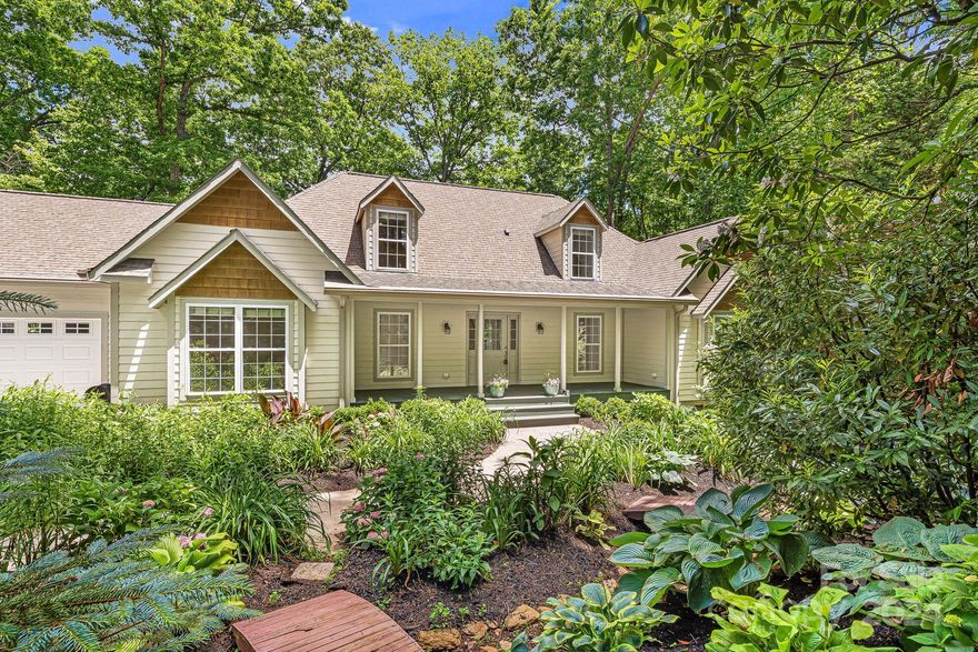 Nestled in tranquil gated community in Black Mountain, this fully renovated home offers unique blend of privacy and accessibility. Boasting an expansive double lot, featuring hiking trails & the potential for building a second home, presenting a rare opportunity for expansion. The home itself is a beautifully maintained 3BR/3.5BA residence with 2 bonus rooms w/walk in closets, perfect for an office or additional living space. Thoughtfully updated, ensuring modern comforts while retaining comfortable charm. The landscaping turns the outdoor areas into a vibrant wonderland, ideal for personal relaxation or entertaining guests. Storage abundant, with ample room upstairs and crawl space that can serve as workshop or organized storage. The incorporation of recent updates emphasizes quality w/o compromising style or functionality. Located minutes from downtown, enjoy the convenience of 
nearby shops, restaurants, and entertainment, while benefiting from the peace and beauty of surroundings.