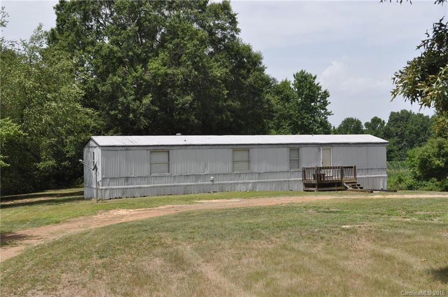 Great 2.444 acre country lot in Piedmont school district!  Clean, spacious 2 bed, 2 full bath singlewide or starter home or build your own home on this pretty wooded lot!