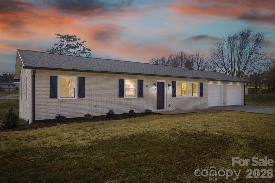 Beautifully updated brick home with two car garage in a peaceful setting on .67 acres in Hudson with easy access to Hwy 321. Updates include new roof and gutters, new windows, new central air conditioning and heat pump, new electrical wiring and panel, new hot water heater and all new plumbing system. Home was renovated to the studs and you have all new drywall and insulation, recessed lighting and fans, new doors, trim, and vinyl plank flooring. Kitchen features white cabinetry, butcher block countertops, and new appliances. Sliding glass door from the kitchen/dining area brings in lots of light and leads you to a 16x11 deck for grilling and relaxing. Property boasts plenty of parking on the newly poured driveway and large garage with two new doors. Property has been lightly landscaped and is ready for your vision!