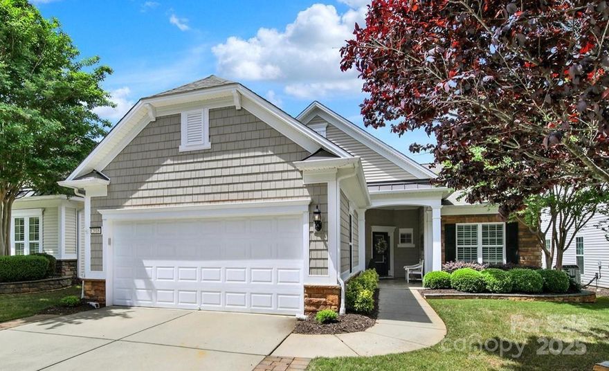 STUNNING & METICULOUSLY maintained Surrey Crest home off the 18th green at Sun City Carolina Lakes! This home is a SHOWSTOPPER & must be seen! Gleaming wood floors welcome you throughout the home. Entertaining gourmet kitchen boasts granite countertops, white subway tile backsplash, SS appliances, roll-out cabinets w/island  & bar seating. Custom Butler's Pantry, wine bar w/cooler & pocket door lead into updated laundry room w/built-in storage. The open living room features a gas log FP, built-in shelving & flows into the light-filled sunroom w/patio access. French doors lead into office/study. The spacious primary suite sits at the rear of the home w/views of the backyard, a tray ceiling & walk-in custom closet. The ensuite bath boasts a dual sink vanity, garden tub, & glass enclosed shower. The jewel of the home is the expansive paver patio w/landscaping, evening lights & pergola overlooking golf course views. Entire home is Elegance at its finest! 55+ resort style amenities.